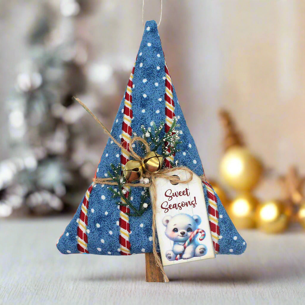 Decorative Christmas tree ornament with candy cane details and a tag
