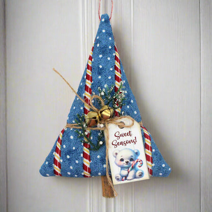 Decorative Christmas tree ornament with candy cane details and a tag on a white background