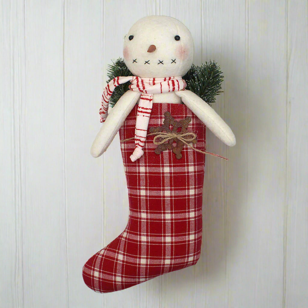 Primitive handmade snowman in a red and white homespun stocking