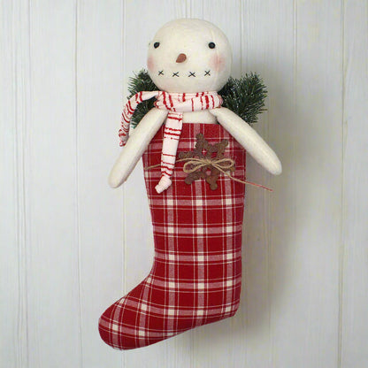 Primitive handmade snowman in a red and white homespun stocking