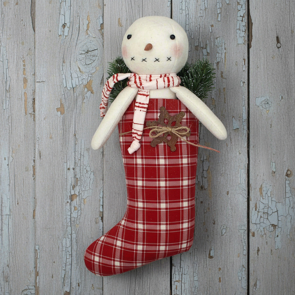 Primitive snowman in a red and white homespun stocking