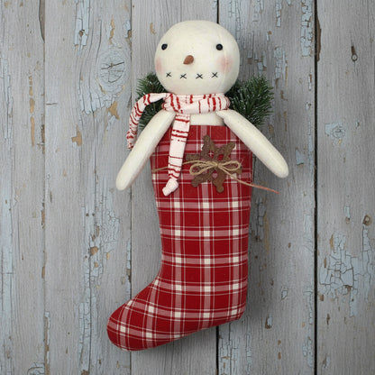 Primitive snowman in a red and white homespun stocking