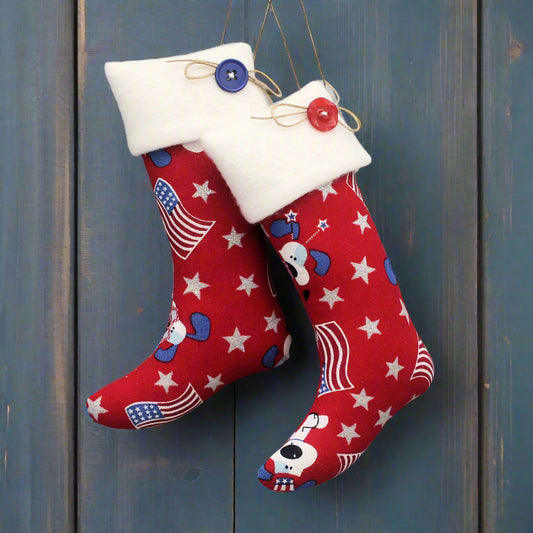 Christmas stocking ornaments with white stars, American flags, and patriotic puppy dogs
