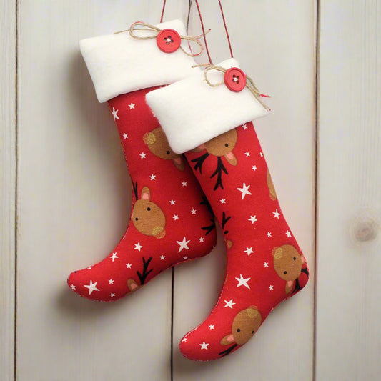Christmas stocking ornaments with cute reindeer on a red background with white cuffs