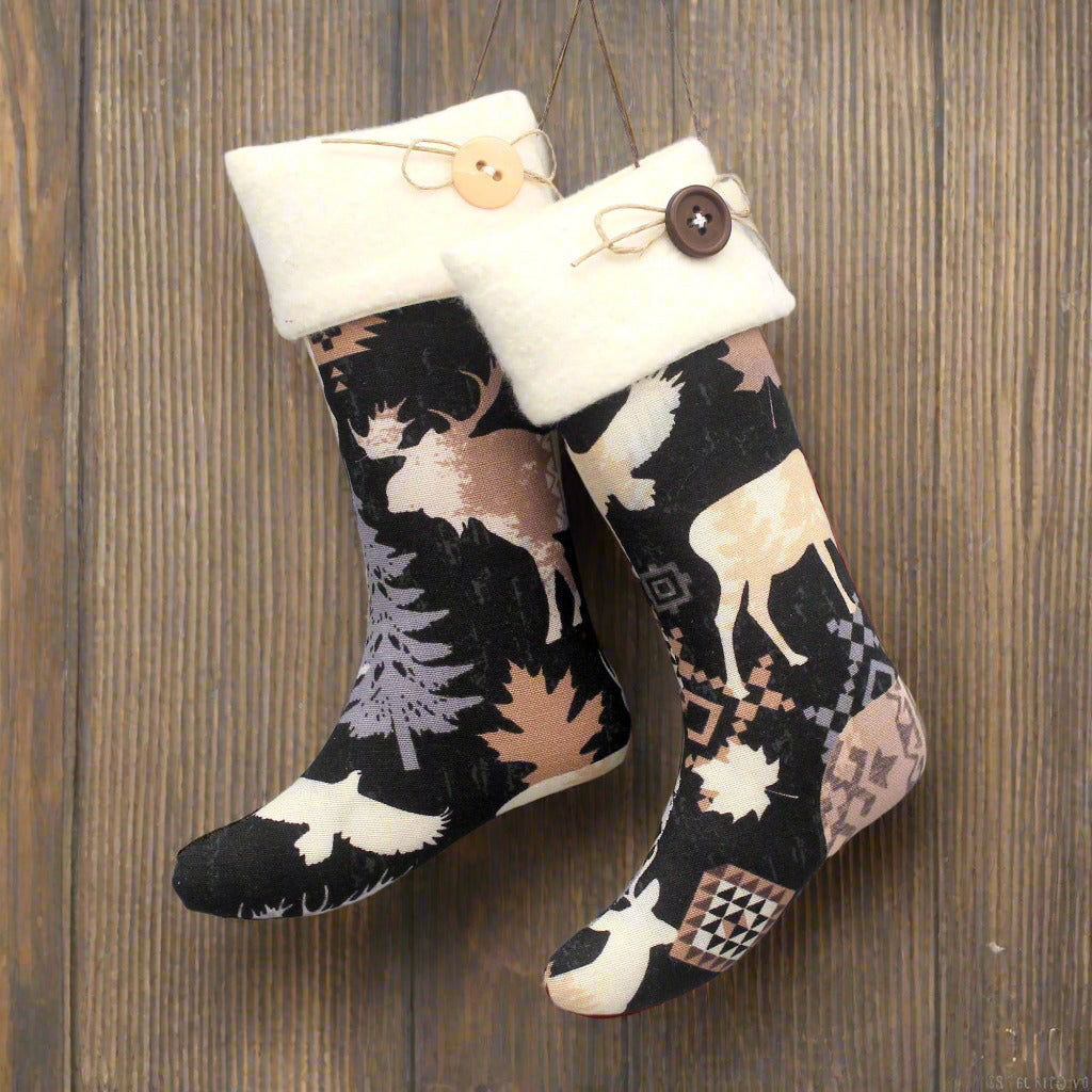 Pair of Christmas stocking ornaments with animal pattern and white cuff hanging