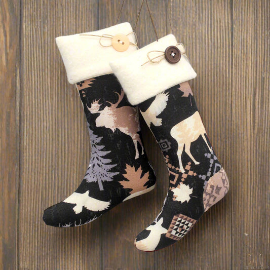 Pair of Christmas stocking ornaments with animal pattern and white cuff hanging