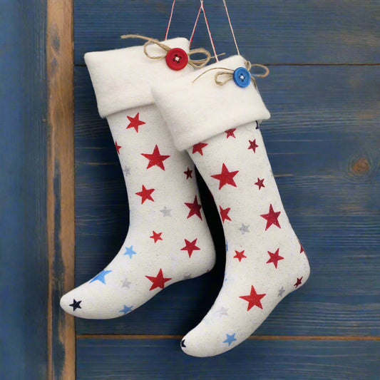 White stocking ornaments with red and blue star patterns
