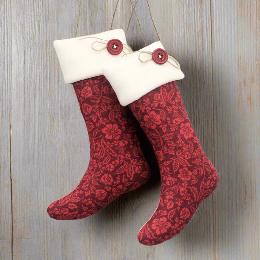 Red patterned stocking ornaments with white cuffs and red buttons