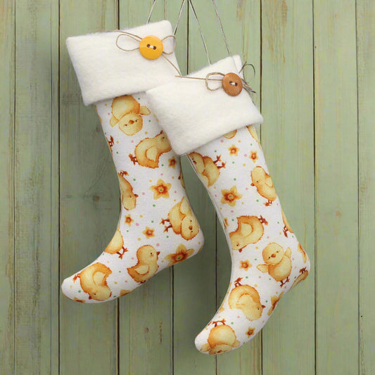 White boot-shaped stockings with duck pattern and buttons