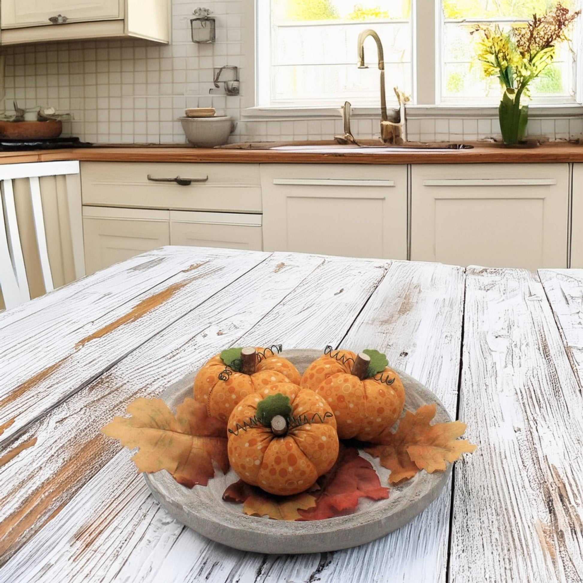 Decorative pumpkins on a wooden table in a kitchen