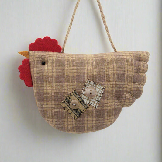 Fabric chicken-shaped ornament with plaid pattern and red comb on a white background