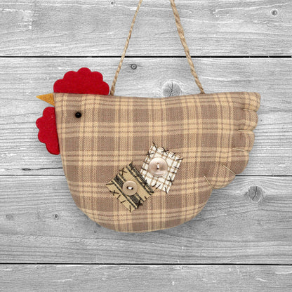 Fabric chicken-shaped ornament with plaid pattern and red comb on a white background
