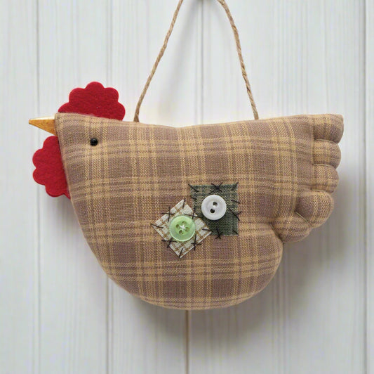 Fabric chicken ornament with buttons on a white background