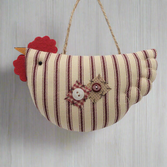 Striped fabric chicken decoration with a red comb on a white background