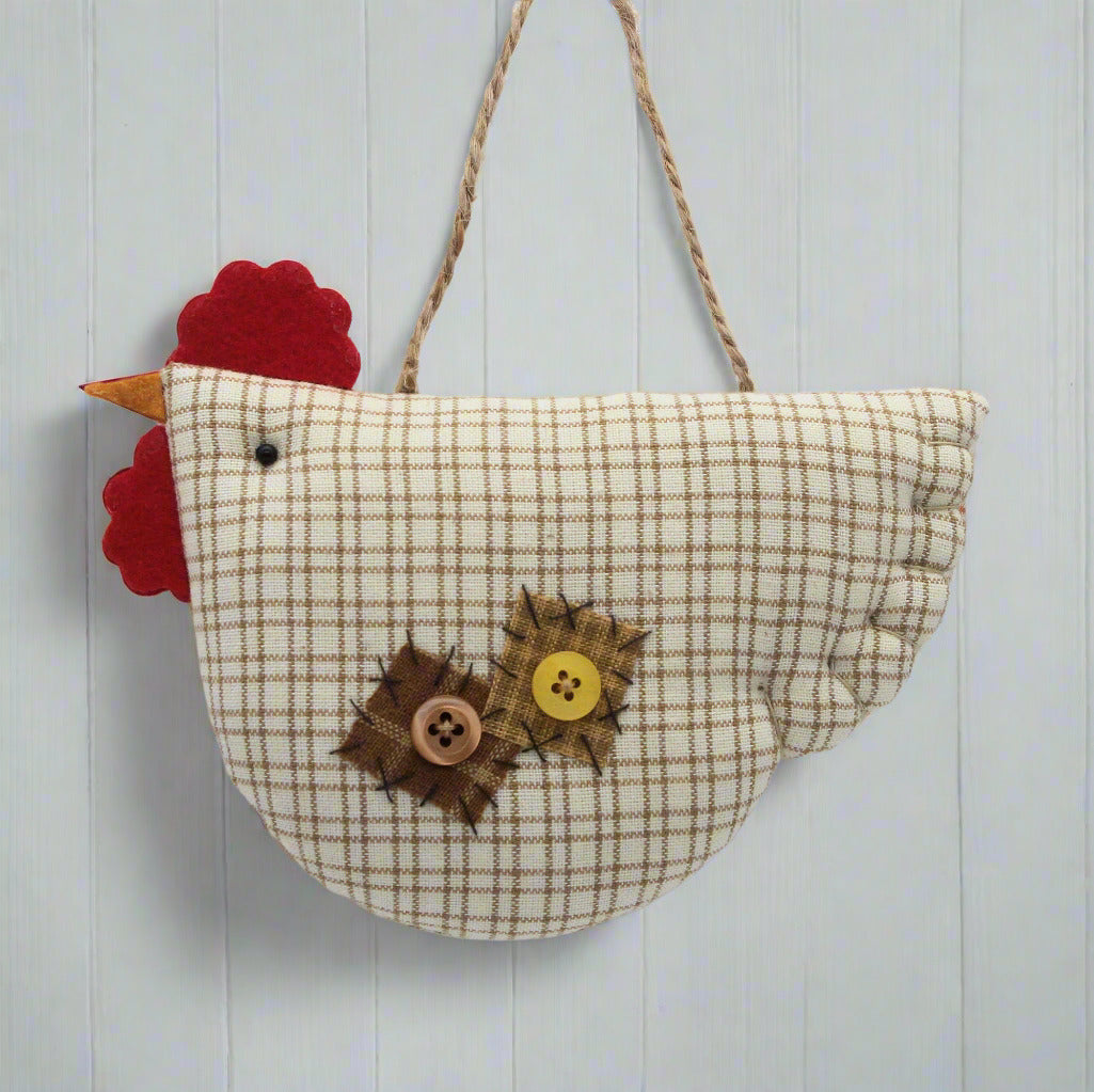 Fabric chicken ornament with buttons on a white background