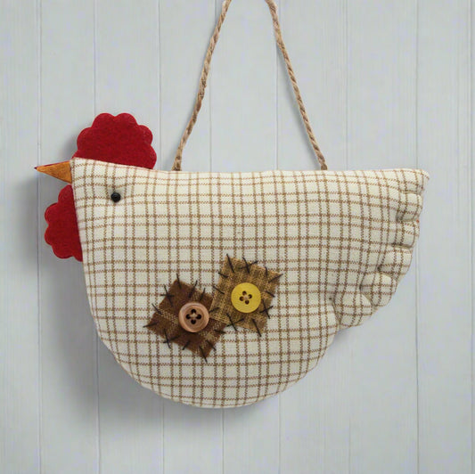 Fabric chicken ornament with buttons on a white background