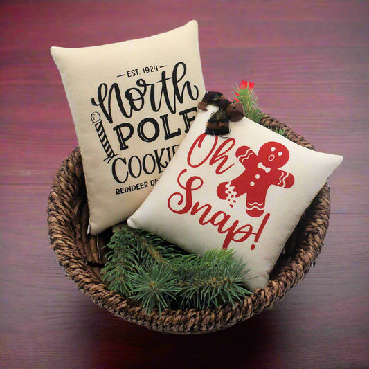 Set of two screen printed mini pillow bowl fillers with cookie and gingerbread designs