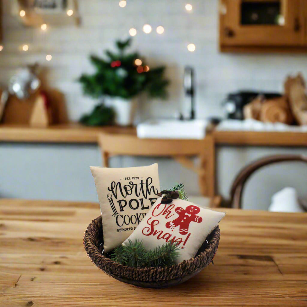 Set of two screen printed mini pillow bowl fillers with cookie and gingerbread designs