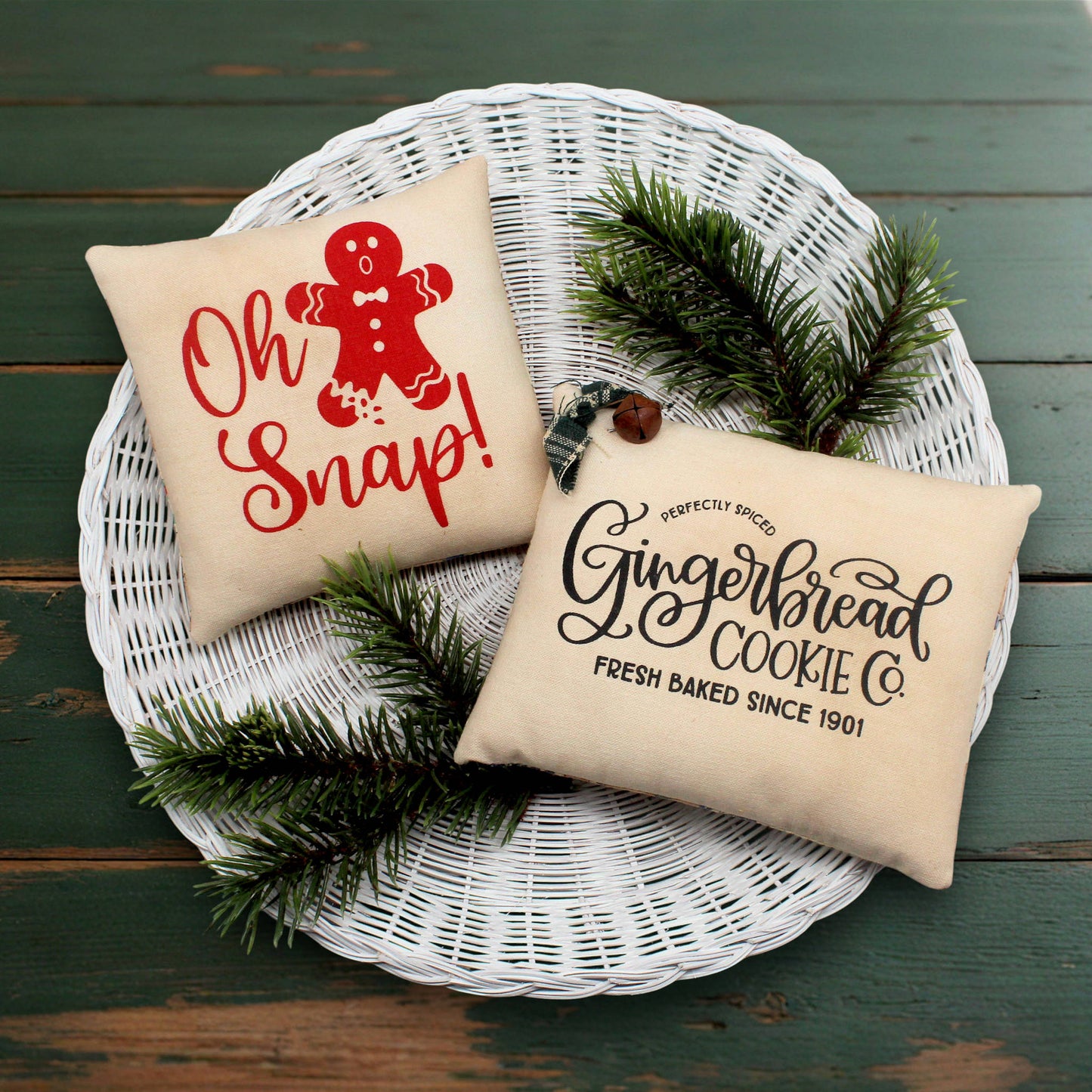 Set of two screen printed mini pillow bowl fillers with gingerbread cookie text and designs