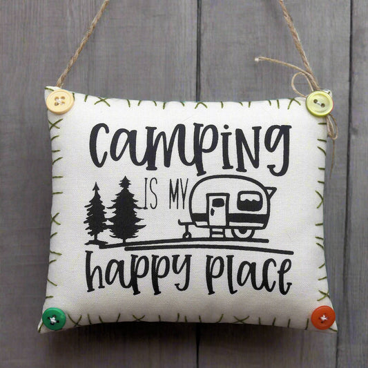 hanging mini pillow sign that reads camping is my happy place