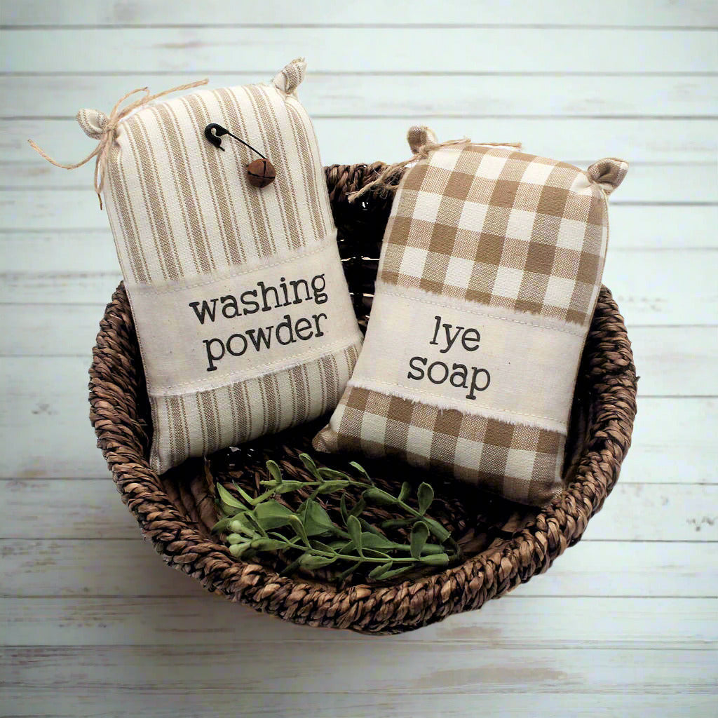 Set of two miniature sack laundry room bowl fillers with labels for washing powder and lye soap
