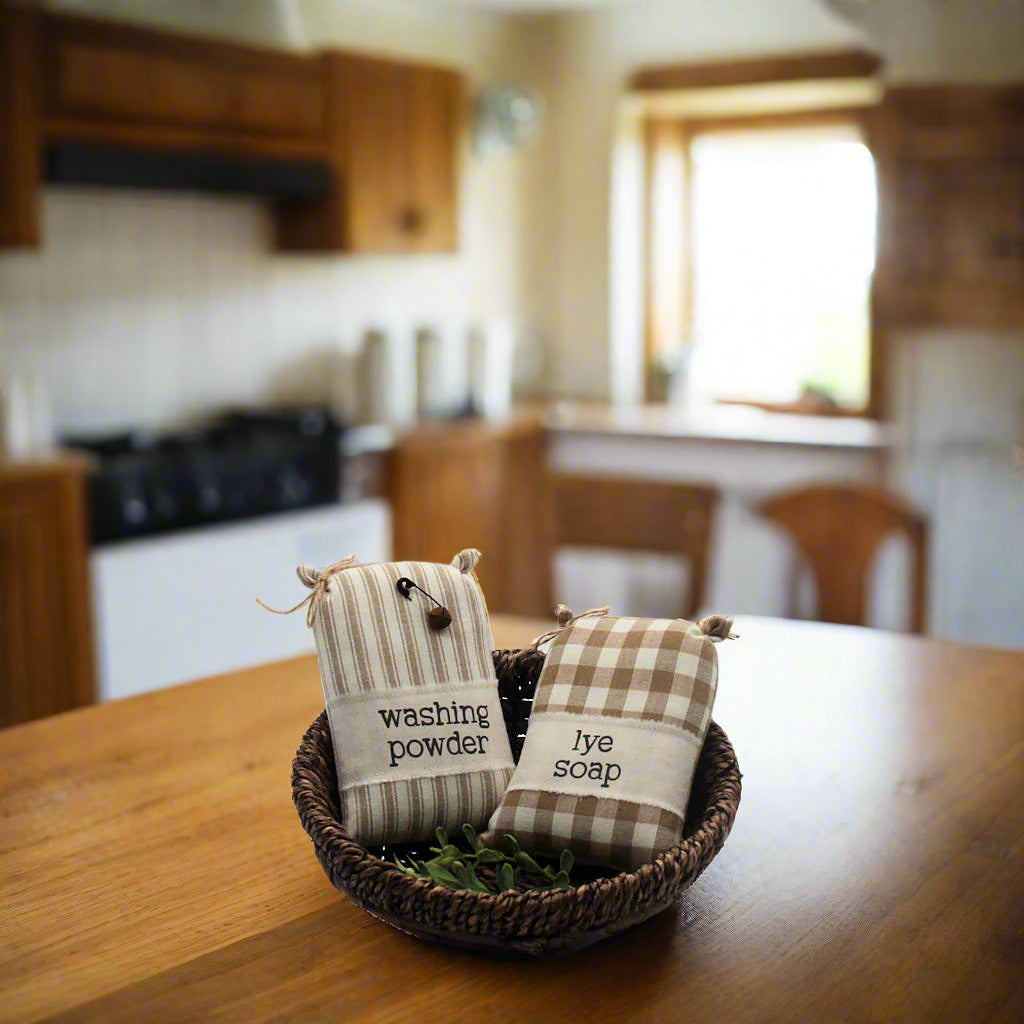 Set of two miniature sack laundry room bowl fillers with labels for washing powder and lye soap
