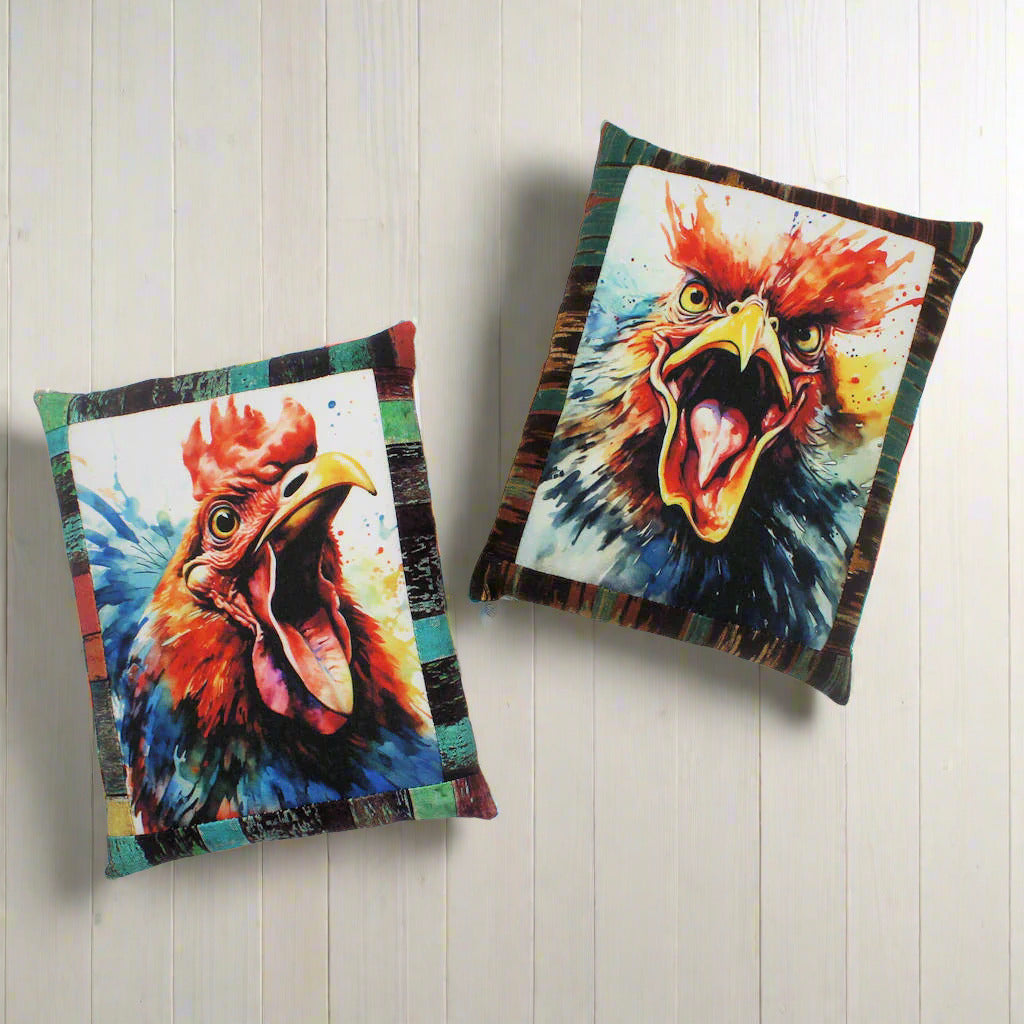 Two colorful rooster pillows on a white background