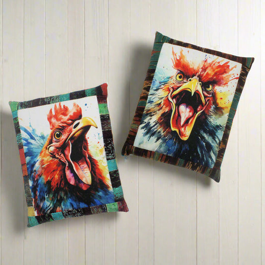 Two colorful rooster pillows on a white background