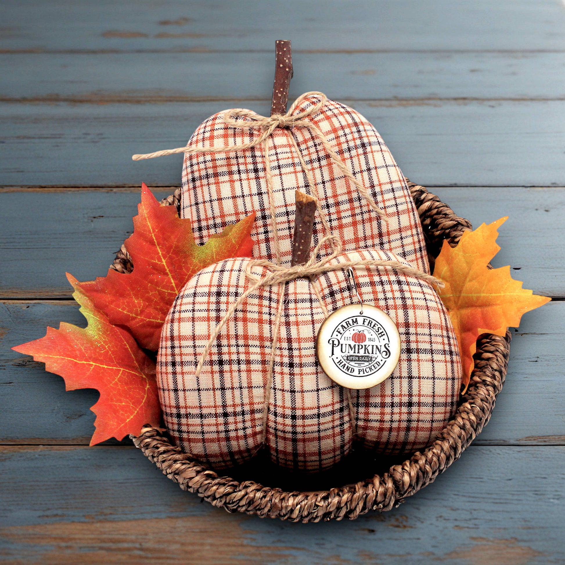 Set of two handmade pumpkin bowl fillers sewn from homespun fabric woven with orange, brown and cream color along with a wooden tag