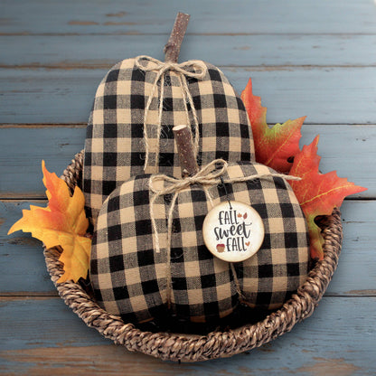 Set of two country primitive pumpkin bowl fillers for autumn sewn from black and tan checked homespun fabric.  The pumpkins have stick stems and a wooden tag.