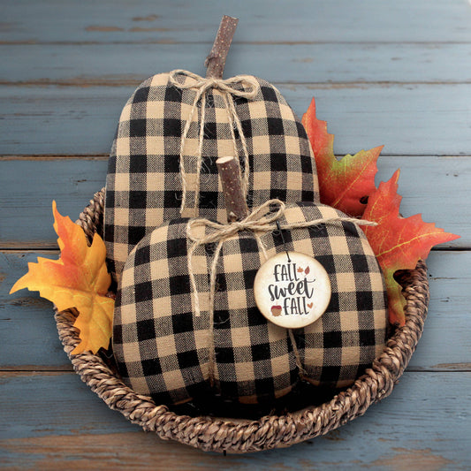 Set of two country primitive pumpkin bowl fillers for autumn sewn from black and tan checked homespun fabric.  The pumpkins have stick stems and a wooden tag.