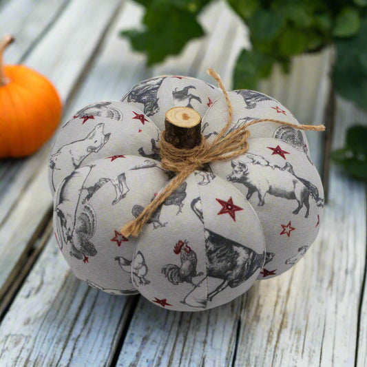 Decorative pumpkin with a gray farmhouse patterned fabric