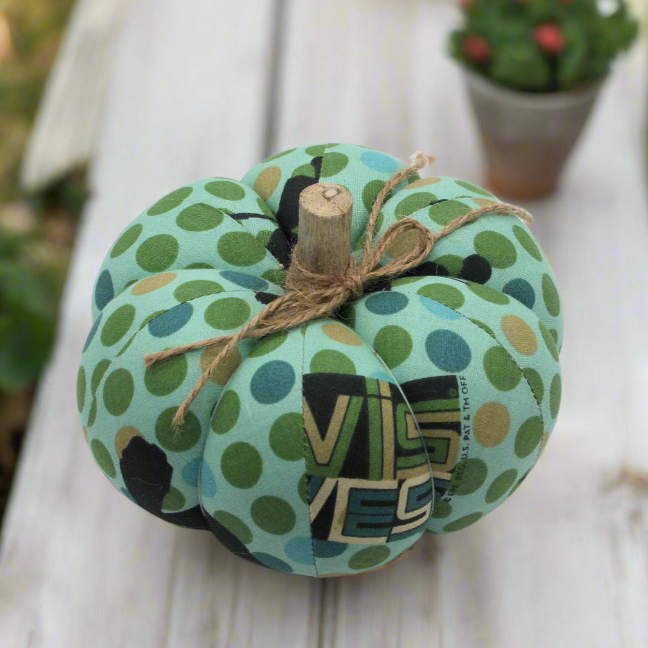 Decorative pumpkin with green polka dot pattern