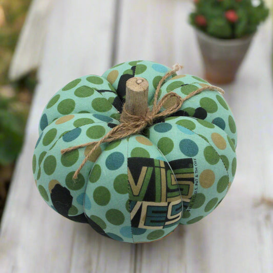 Decorative pumpkin with green polka dot pattern