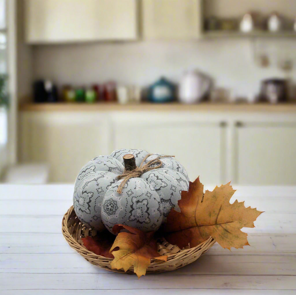 Decorative pumpkin with leaf on a kitchen counter