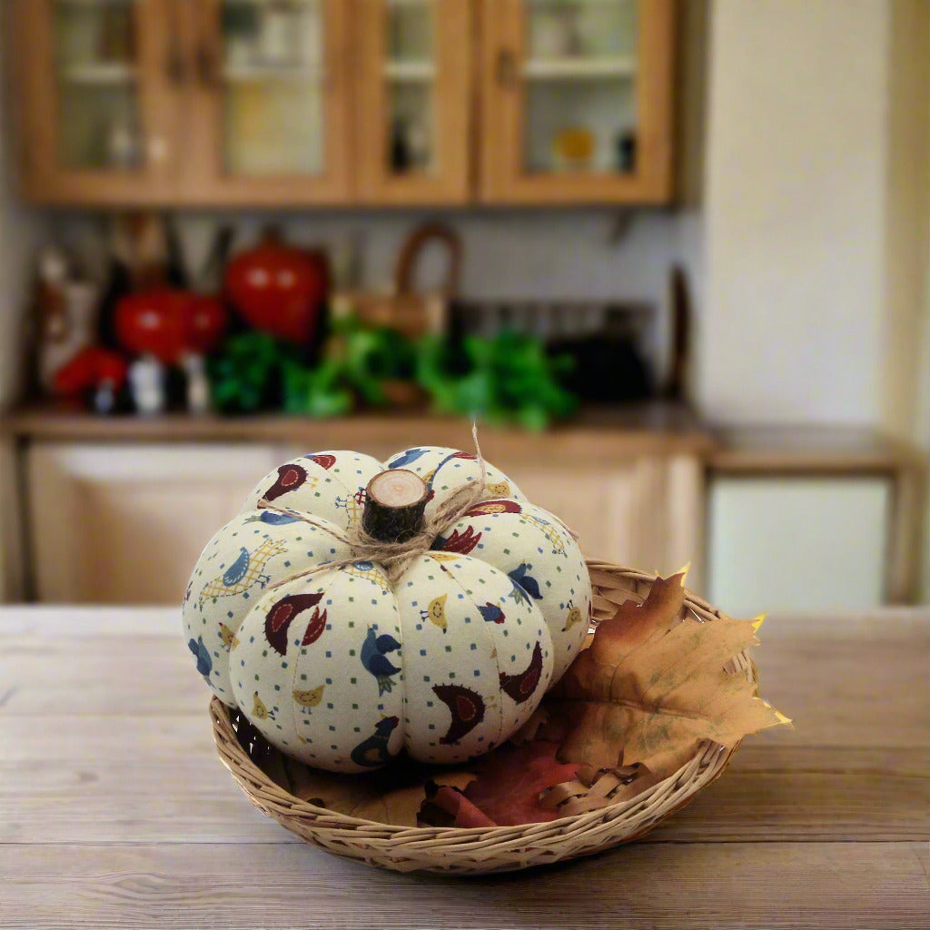 Decorative pumpkin with bird pattern in a woven basket