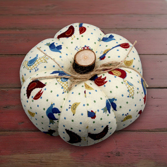 Decorative fabric pumpkin with a folk art bird design