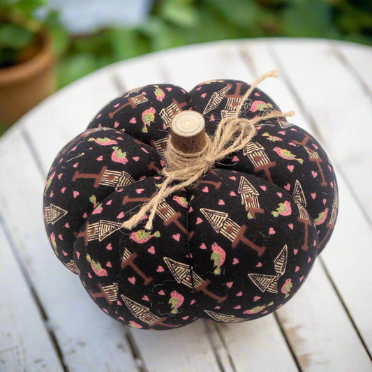 Decorative fabric pumpkin with a birdhouse design