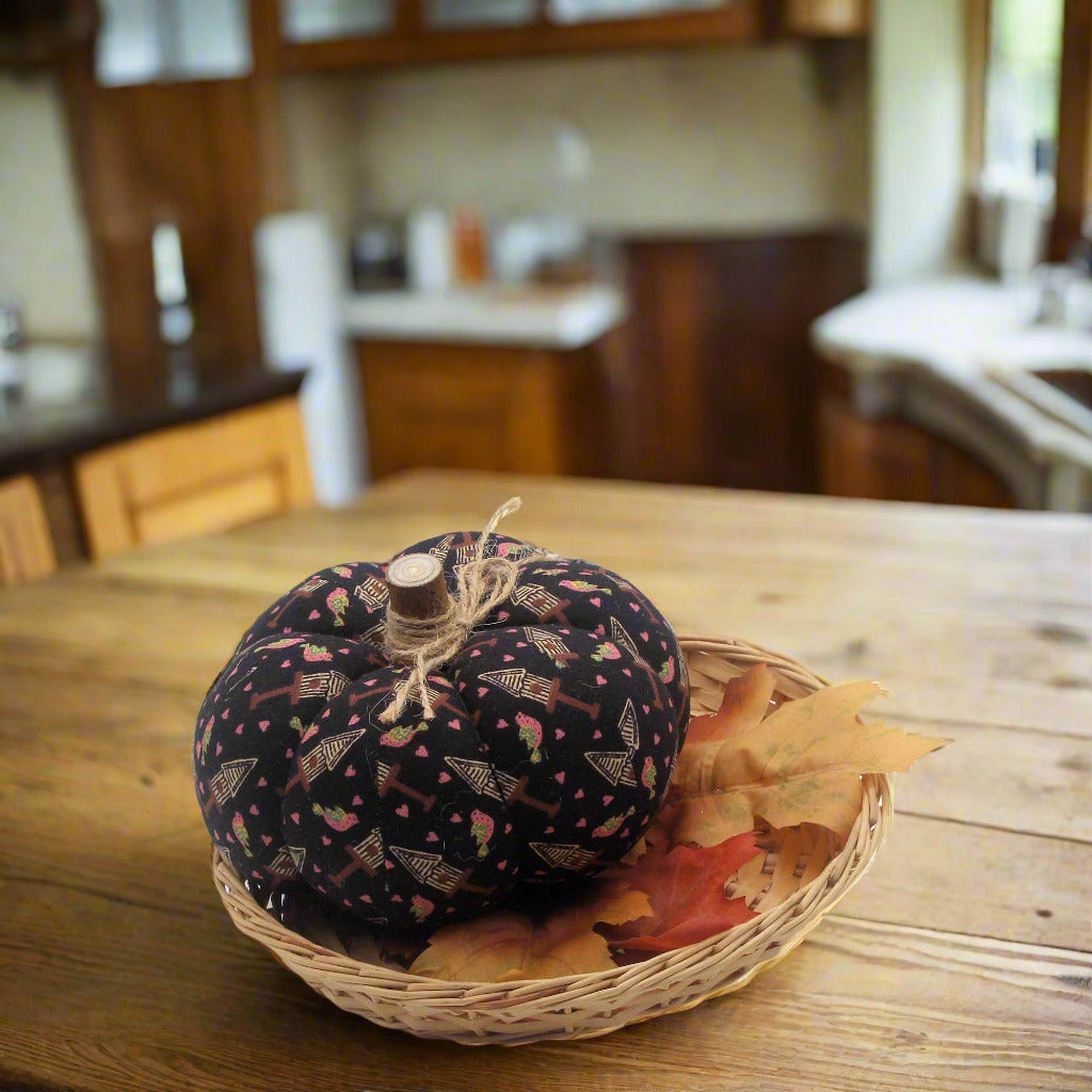 Decorative fabric pumpkin with a birdhouse design