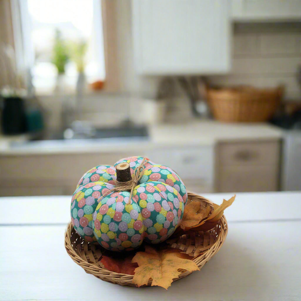 Decorative pumpkin with colorful button print fabric in a kitchen