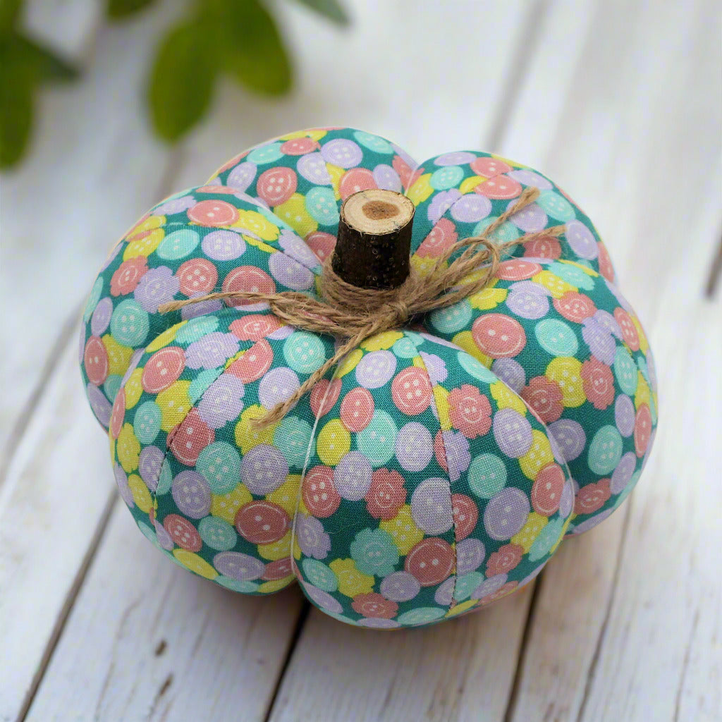Decorative pumpkin with a pastel button patterned fabric