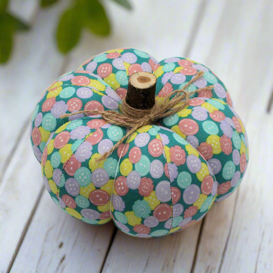 Decorative pumpkin with a pastel button patterned fabric
