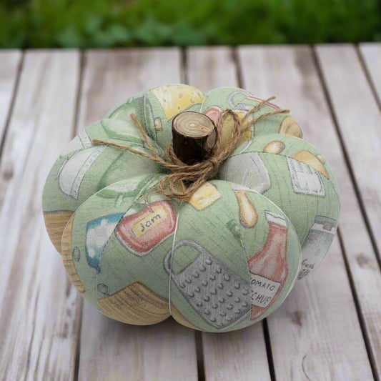 Decorative fabric pumpkin in a pastel kitchen print