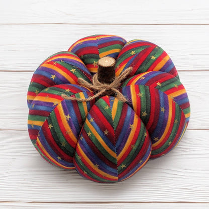 Colorful fabric pumpkin with a zigzag and metallic star design
