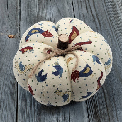 Decorative pumpkin with fabric pattern on a wooden surface