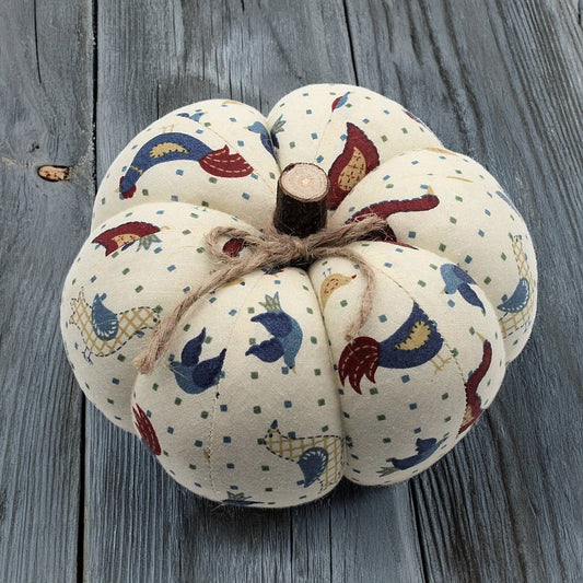 Decorative pumpkin with fabric pattern on a wooden surface