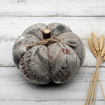 Decorative fabric pumpkin with a farmhouse design