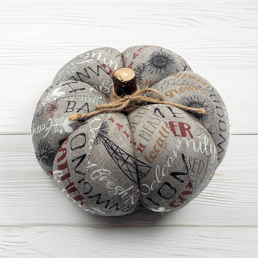 Decorative fabric pumpkin with a gray farmhouse design