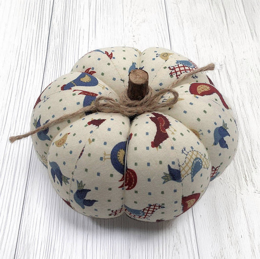 Decorative fabric pumpkin with a folk art bird design