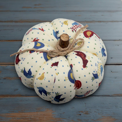 Decorative fabric pumpkin with a folk art bird design